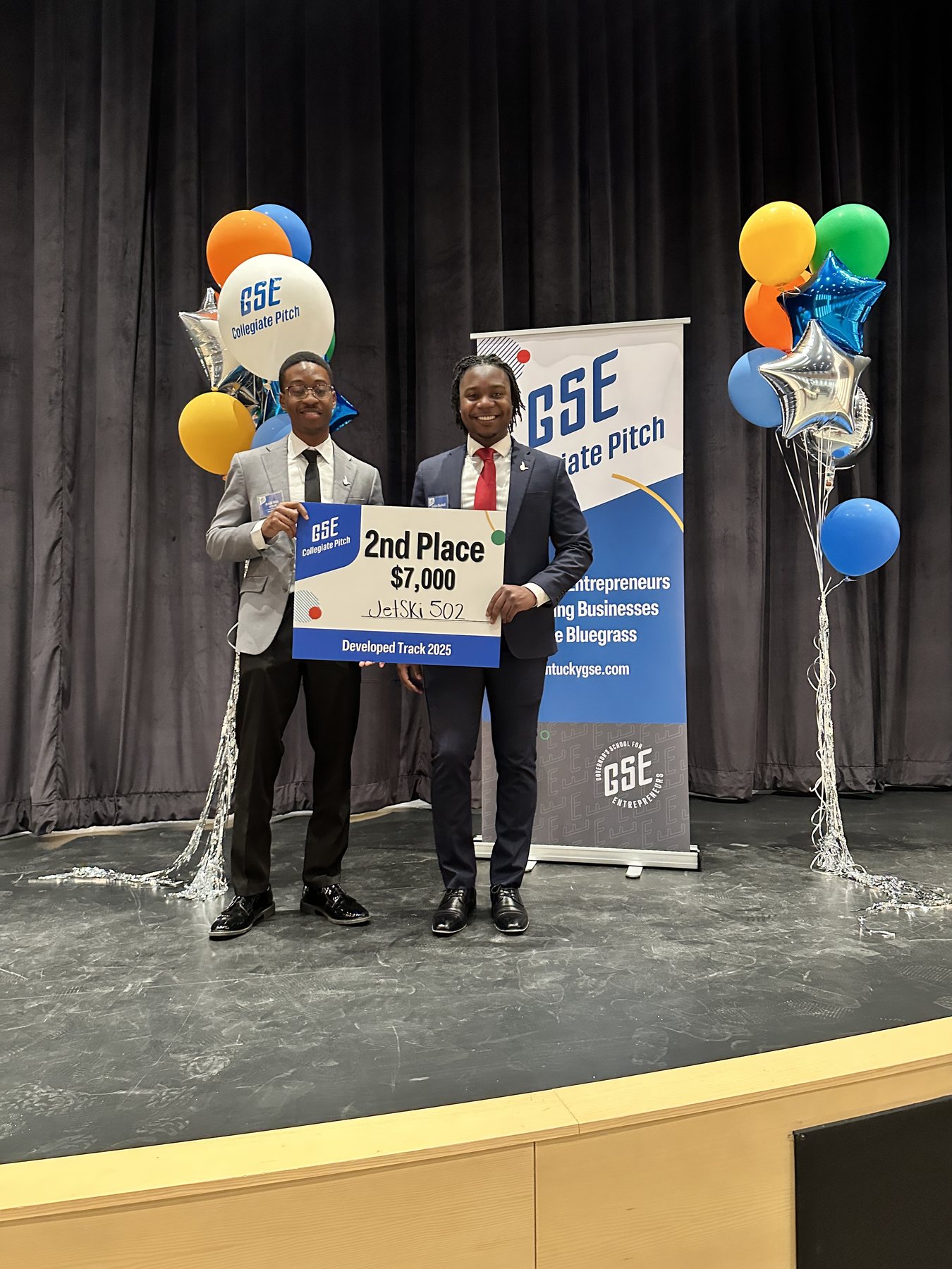 Arnold Moto and Golden Marshindi receiving second place at the GSE Collegiate Pitch competition