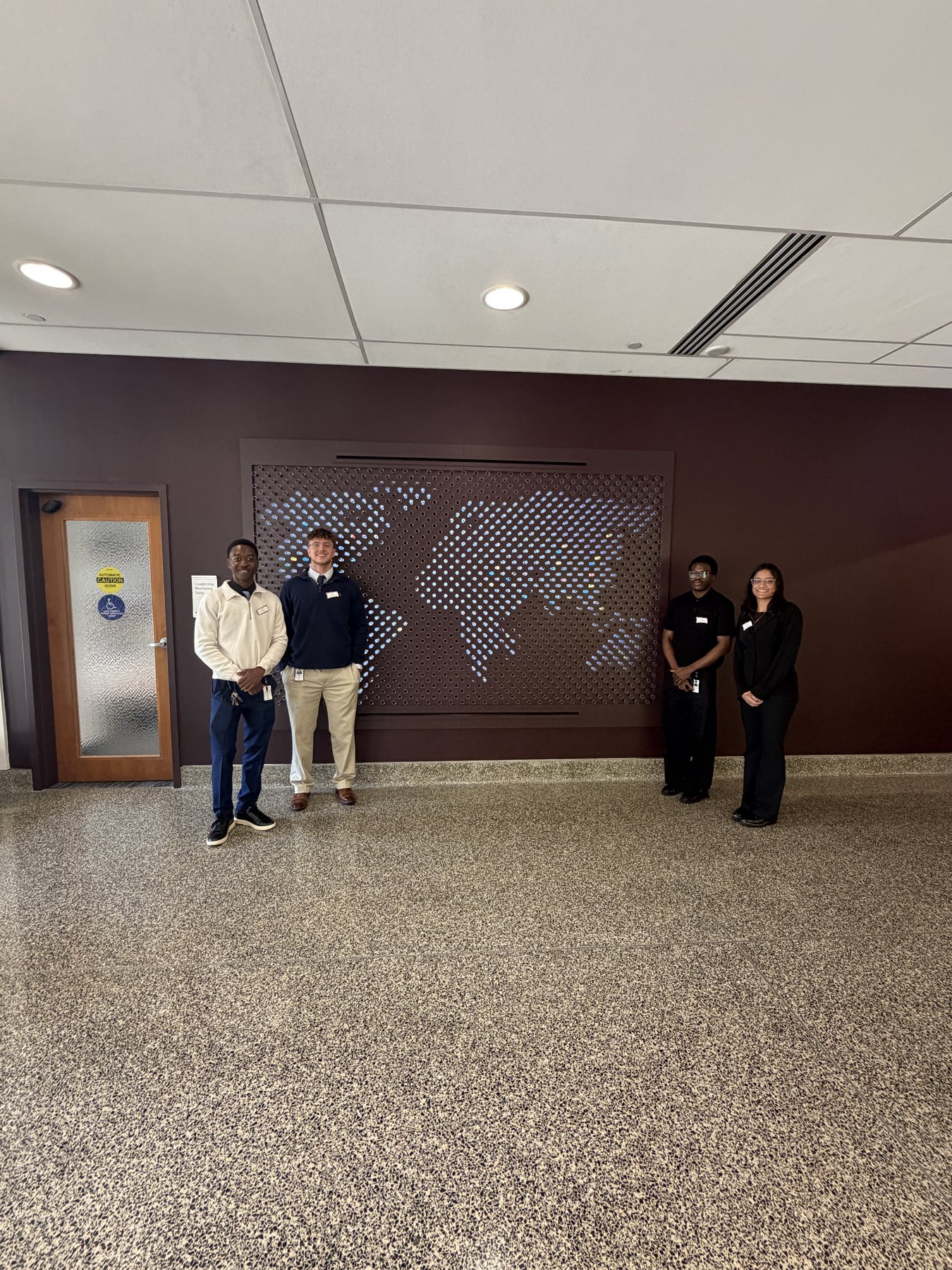 Arnold Moto with colleagues during a professional program