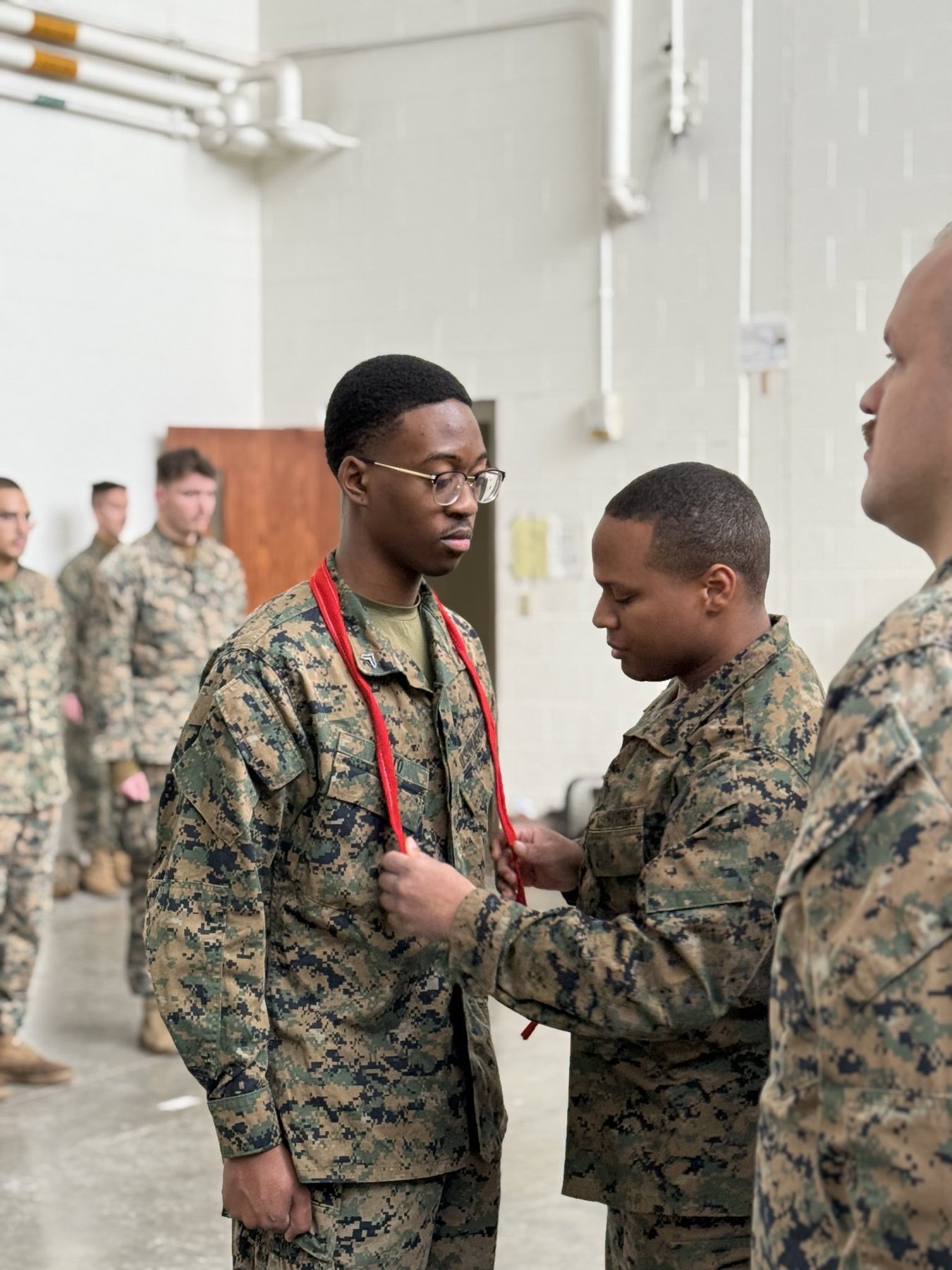 Arnold Moto receiving recognition in the United States Marine Corps