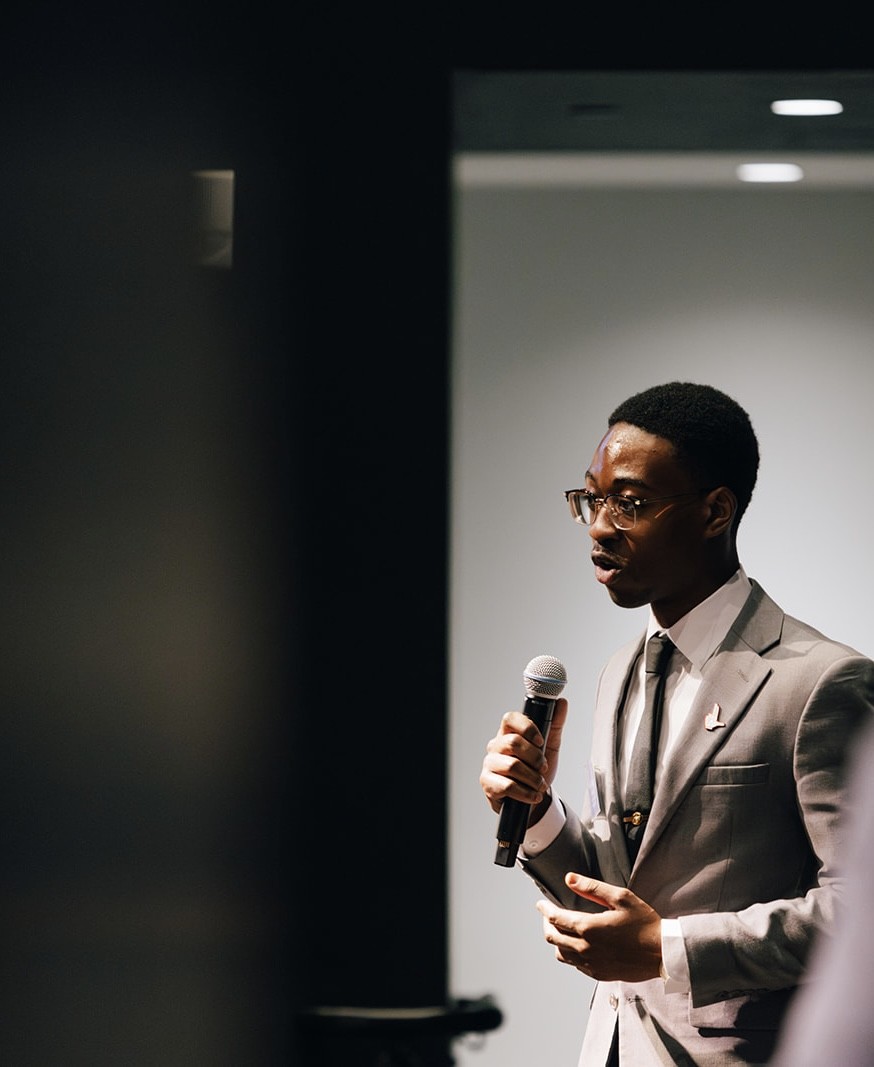 Arnold Moto speaking at an event