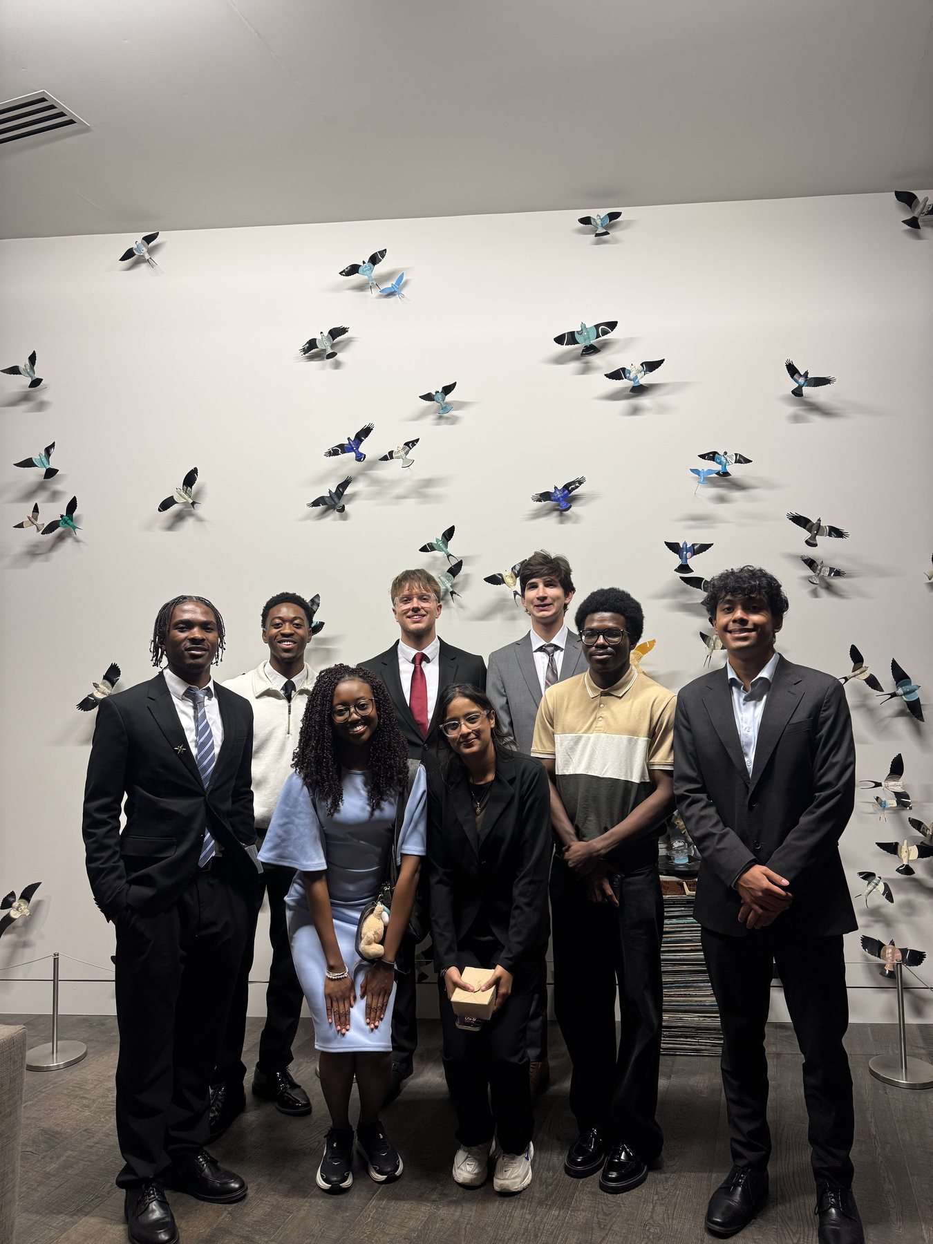Arnold Moto with peers at a professional student event